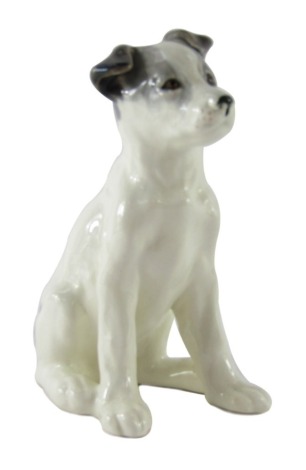 A USSR Konakova porcelain figure of a seated dog, on a white glazed ground with grey spotting, printed marks, 20cm high.