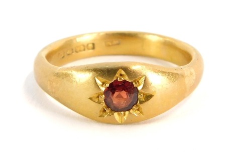 A 22ct gold dress ring, with illusion set ruby, on a converted band, Birmingham 1927, size S 1/2, 9.7g all in.