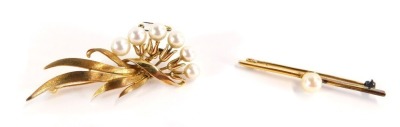 Two bar brooches, comprising a floral spray brooch, with cultured pearl bead attachments, on floral spray, yellow marked stamped K14, 10.7g all in, 6cm wide, together with a single pin bar brooch, with central cultured pearl, yellow metal stamped 9ct, 3.8