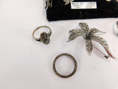 A group of silver and other marcasite set jewellery, comprising a silver and marcasite bow dress ring, a silver and marcasite tulips brooch, four paste stone set brooches, a silver and green stone paste set dress ring, and a silver and white paste stone e - 2