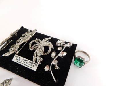 A group of silver and other marcasite set jewellery, comprising a silver and marcasite bow dress ring, a silver and marcasite tulips brooch, four paste stone set brooches, a silver and green stone paste set dress ring, and a silver and white paste stone e - 3