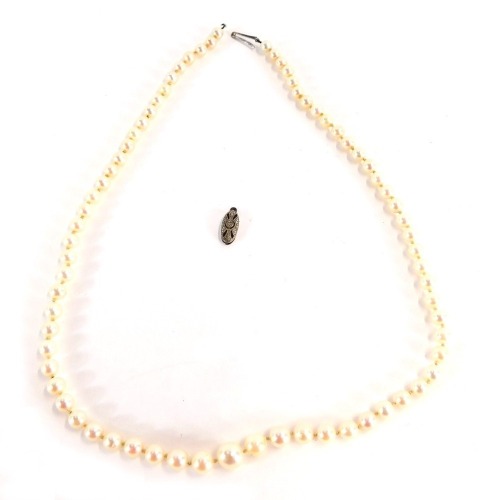 A string of Ciro cultured pearl beads, each on string strand, graduated with a white gold clasp, stamped 9ct, 50cm long. (AF)