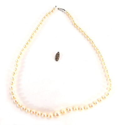 A string of Ciro cultured pearl beads, each on string strand, graduated with a white gold clasp, stamped 9ct, 50cm long. (AF)