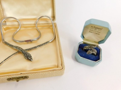 A silver and marcasite set snake jewellery suite, comprising necklace, hinged bangle and dress ring, each marcasite set with green paste eyes, the necklace and bracelet, hallmarked and stamped silver, the ring a later addition unmarked. (3) - 2