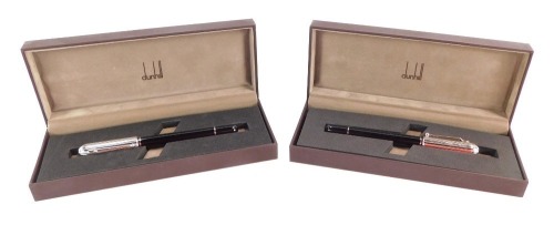 Two Dunhill pens, comprising a fountain pen with 18ct white gold nib, on black stem with silver coloured rims, and a matching biro, boxed. (2)