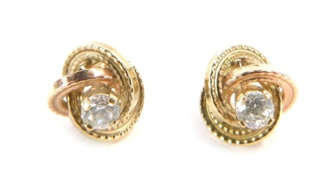 A pair of 9ct gold earrings, in bi-colour decoration with rose and yellow gold in three hoop twist design with central CZ, on central pin back, lacking butterfly backs, 0.8g all in.