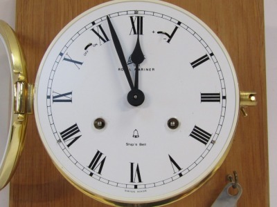 A Royal Mariner ship's wall clock, in brass case with white dial and Roman numerals, dated 1881, with clock key, 23cm x 23cm frame, dial 12cm diameter. - 2