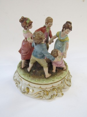 A Capo di Monte porcelain figure group, by Merli, modelled with a family dancing around a tree stump, on a rococo scroll base, 20cm high. - 3