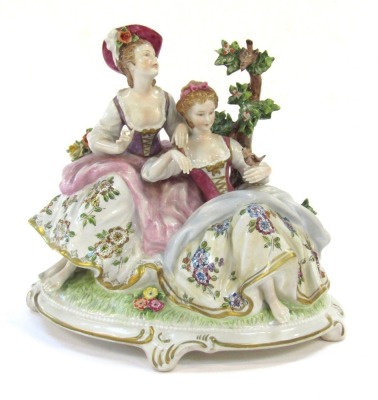 An Unterweissbach porcelain figure group, depicting two ladies with trees and flowers, No 8289A, 1885, printed mark, 20cm high.