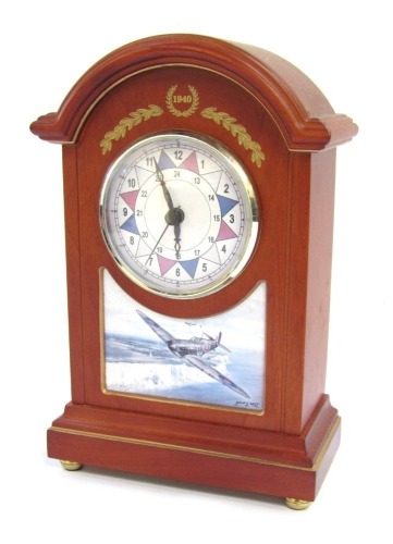 A Bradford Exchange Defending The Realm Anniversary Clock, commemorating The Battle of Britain 70th Anniversary sector clock, with date crest of 1940, and print after Philip E West, raised on brass ball feet, 22.5cm high, 14.5cm wide, 7cm deep.