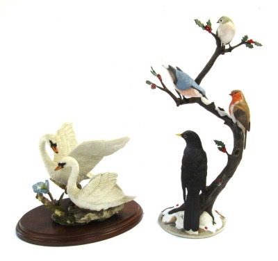 Two bird figure groups, comprising a Country Artist's Swan and Pair, by Andrew McCallum, No 01786, 18cm high, and a Winter Friends by Anne Richmond, Danbury Mint, figure group, 38cm high, with one Country Artist box.