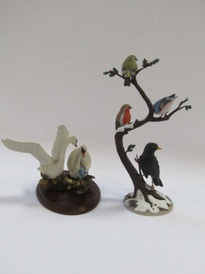 Two bird figure groups, comprising a Country Artist's Swan and Pair, by Andrew McCallum, No 01786, 18cm high, and a Winter Friends by Anne Richmond, Danbury Mint, figure group, 38cm high, with one Country Artist box. - 3