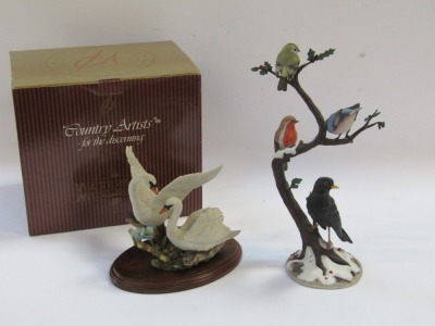 Two bird figure groups, comprising a Country Artist's Swan and Pair, by Andrew McCallum, No 01786, 18cm high, and a Winter Friends by Anne Richmond, Danbury Mint, figure group, 38cm high, with one Country Artist box. - 4