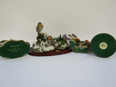 Four Danbury Mint and other figure groups, comprising Danbury Mint Feeding Time by Anne Richmond, 14cm high, Country Artist pair of Robins with Crocus, 21cm high, A First Snow by Anne Richmond, Robin figure group on wooden plinth base, 32cm wide, and Afte - 3