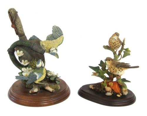 Two Country Artist figure groups, comprising a pair of Song Thrushes with ivy and plant pot, No 02461, 17cm high, and Enchanted Spring, No 01899, 22cm high, boxed.