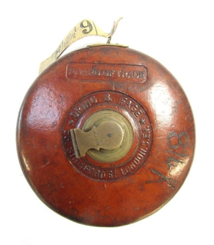 A Dring & Fage Board of Trade tape measure, in leather casing, 56 Stamford Street London.