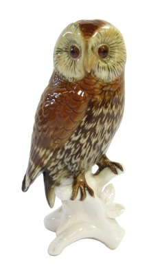 A Karl Ens porcelain figure of an owl, modelled perched on a branch, printed mark, 15cm high.