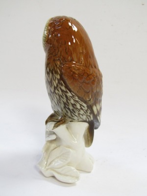 A Karl Ens porcelain figure of an owl, modelled perched on a branch, printed mark, 15cm high. - 2