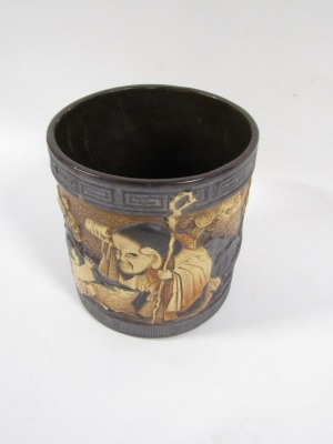 A Bretby planter, on black ground with Oriental figures and flowers, stamped to underside, 22cm high. (AF) - 5