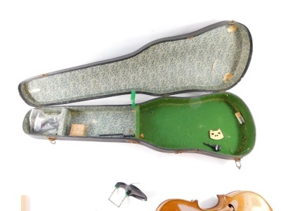 An early 20thC violin, with copy of Stradivarius, Berlin label, with two piece back, scroll end, ebonised knops and interior label, overall 59cm long, cased. (AF) - 2