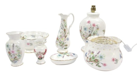 A group of Aynsley porcelain Wild Tudor pattern wares, comprising table lamp, water jug, scent bottle and stopper, oval trinket box and cover, rose bowl, fruit bowl, and vase, with three boxes.