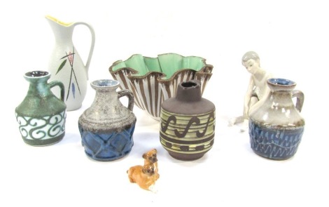 A group of studio pottery and ceramic wares, Nao figure of a seated ballerina (AF), Beswick figure of two Boxer puppies (AF), Italian studio pottery handkerchief bowl, Strehla Import ware jugs, and a West German mid Century studio pottery jug. (1 tray)