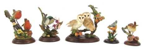 Five Country Artist figures and groups, comprising Nuthatch with dandelion, Wren on perch, black chinned Hummingbird, No 01320, pair of Robins with Primroses, and Barn Owl pair with crab trees, No 01948, unboxed.