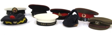 A group of Regimental and Military caps, to include HMS Raleigh, Soviet and Russian caps and berets, a Royal Scots Dragoon Guards Waterloo beret, and a Merchant Navy officer's peak cap, etc. (1 box)