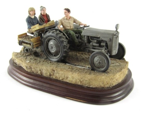 A Border Fine Arts figure group 'Maris Crop', depicting figure on tractor and two potato pickers, on a wooden base, 15cm high, 26cm wide. (AF)