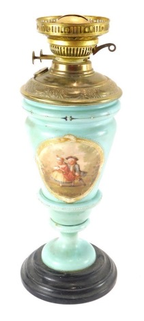 A Victorian turquoise opaque glass oil lamp base, with brass applied top, with a painted oval panel depicting two figures playing, on a stepped ebonised base, 43cm high.