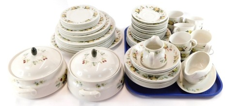 A Royal Doulton Miramont pattern part dinner service, comprising two tureens, ten cups and saucers, sauce boat, milk jug, three bowls, serving plate, six bread plates, nine side plates, four larger plates, nine dinner plates, and six soup bowls. (a quanti