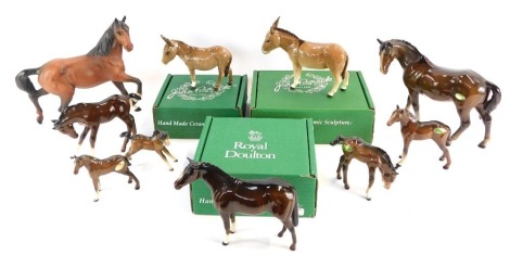 A group of Beswick and Royal Doulton figures, comprising four foals, a large Beswick donkey, a small Beswick horse, small Beswick donkey, a Royal Doulton matt glaze galloping horse and two further Beswick horses, with four boxes. (10)