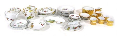 A Royal Worcester Evesham pattern dinner and oven wares, comprising graduated set of three tureens and lids, serving tray, teapot, flan dish, bowls, gravy boat, dinner plates, saucers, etc, and a Royal Worcester gold lustre finish part tea service, compri