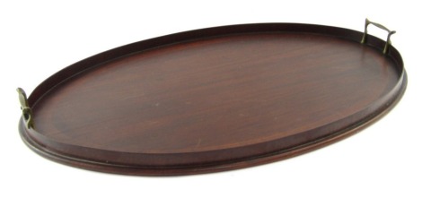 An Edwardian oval mahogany serving tray, with satinwood cross banding, and twin brass handles, 68cm x 46cm.