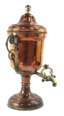 A Victorian copper and brass tea urn, of lidded, twin handle baluster form, with a brass tap, 50cm high.