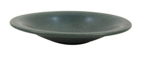 A Holbaek Danish studio pottery bowl, on a green and blue mottled ground, bearing signature Holbaek Danmark, 33cm diameter.