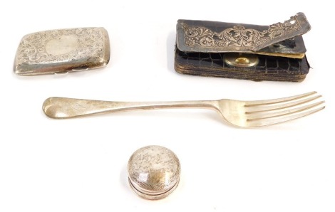 A group of silver, comprising a silver pill box, a George V silver cigarette case, Birmingham assay with floral scroll detailing, a leather and silver purse, together with a silver table fork, bearing initials M J H, 6oz gross.