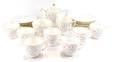 A Minton porcelain tea service in the Petunia pattern, comprising teapot, milk jug, sugar bowl, eight tea plates, seven tea cups and eight saucers. (1 tray)