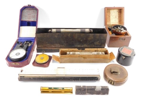 A group of miscellaneous military and measuring effects, a brass spirit level, leather tape measure, a Howden Calculex compass, an illumination meter by GEC, an International Interventions Exhibition Awarded Silver Medal Correction air meter, No 1204, cas