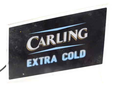 A Carling Extra Cold Perspex illuminated advertising sign, 25cm high, 33cm wide, 12cm deep.