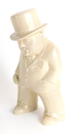 A Bristol fawn pottery figure of Winston Churchill, modelled standing, printed mark, 19cm high.