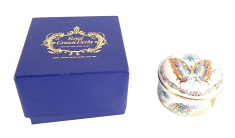 A Royal Crown Derby porcelain Butterflies of The World cylindrical box and cover, Europe-Two Tailed Pasha, printed marks, boxed.