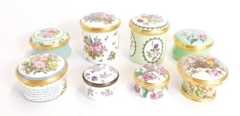 Halcyon Days enamel boxes, floral decorated, of cylindrical form, various sizes. (8)