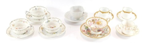 A group of various cups and saucers, to include a Dresden 19thC ceramic and gilt tulip cup and saucer, three Jackson & Goslyn floral cups and saucers, a pair of Royal Crown Derby coffee cans on white finish with gilt surround, a lustre finish shell tea cu