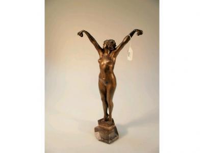 An Art Deco style bronze figure of a naked woman with castanets on granite base