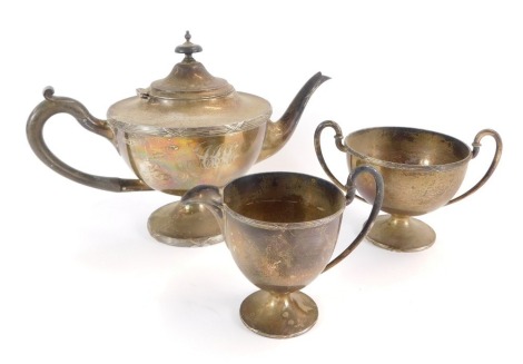 A Walker and Hall George V silver three piece tea service, of baluster form, monogram engraved, comprising teapot, milk jug, sugar bowl Walker & Hall, Sheffield 1911, 37¼oz gross.