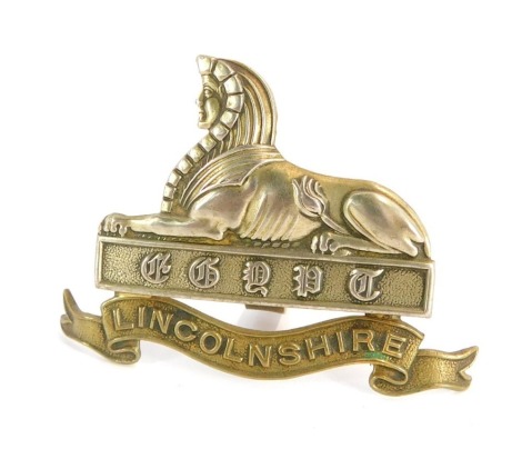 A Lincolnshire Regiment cap badge.