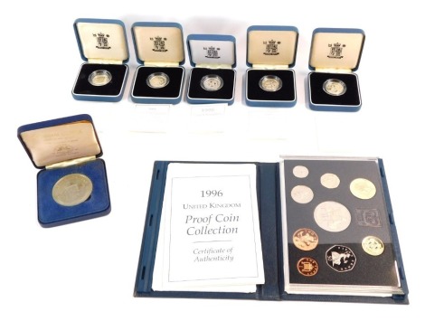 A group of Royal Mint silver proof £1 coins, for 1998, 1999, 1995 and 1997, together with a 1996 United Kingdom proof coin collection set and a Windsor Castle solid Nickel silver limited edition coin, all boxed. (a quantity)