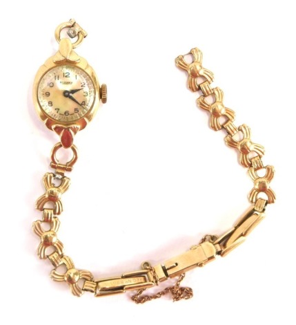 A 9ct Rotary ladies wristwatch, with a mother of pearl dial, on a cross design bracelet, with safety chain, 16cm long, 15.5g all in. (AF)