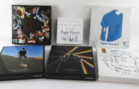 Pink Floyd collector's boxes, comprising The Dark Side of the Moon, The Wall, Wish you Were Here, white The Wall, and two canvases Nick Mason and David Bowie.